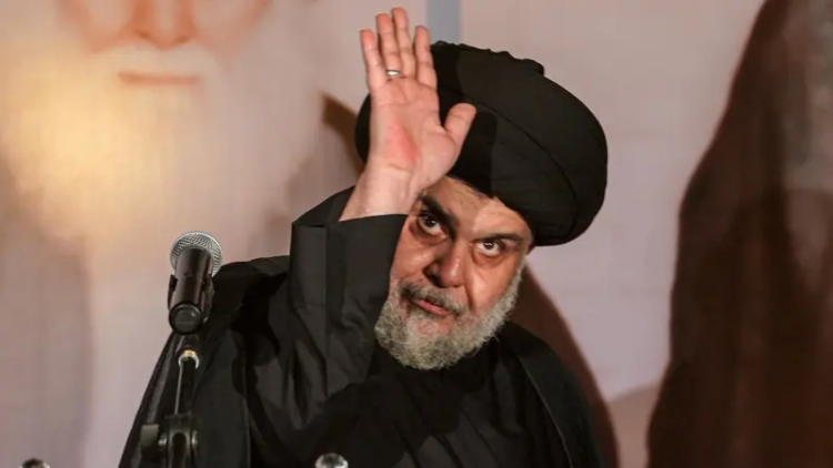 سەركردەیەكی باڵای عێراق داوای سووتاندنی ئاڵای ئەمریكا و ئیسرائیل لە خۆپیشاندانێكی گەورە دەكات